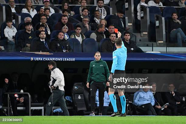 Referee Francois Letexier shows a red card to a member of Real Madrid backroom staff during the UEFA Champions League 2024/25 Quarter Final Second...