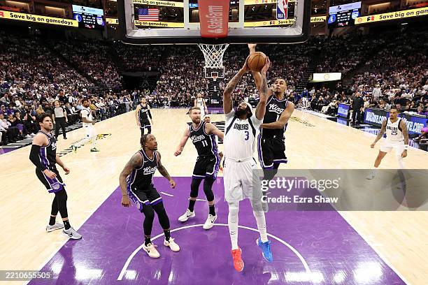 Anthony Davis of the Dallas Mavericks goes up for a shot on Keegan Murray of the Sacramento Kings during the second half of the NBA play-in...