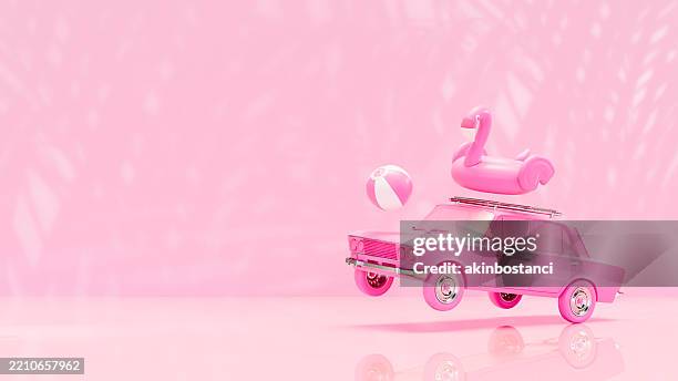 summer holiday travel with car on pink background - pink flamingo floaty bildbanksfoton och bilder