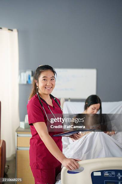 charting pediatric care - nurse charting stock pictures, royalty-free photos & images