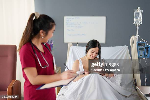 charting pediatric care - nurse charting stock pictures, royalty-free photos & images