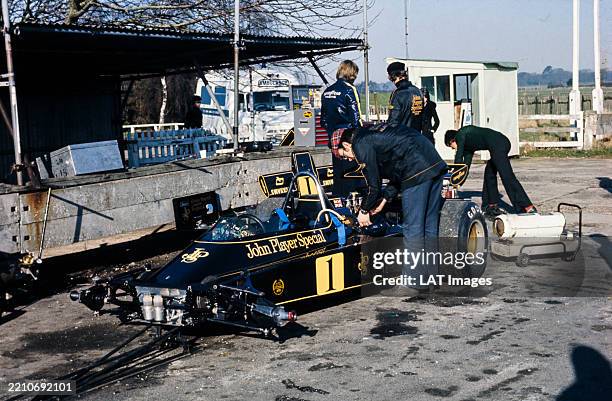 Lotus mechanics and engineers work on the Lotus 72E Ford in the pit lane during a test at Goodwood Circuit, West Sussex, United Kingdom, 14th...