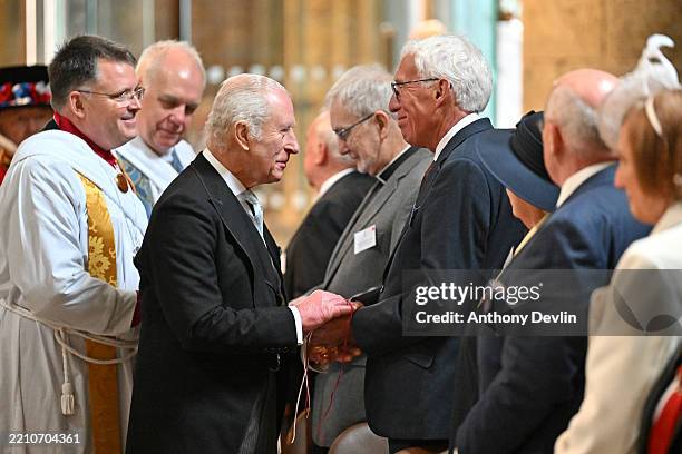 King Charles III meets the congregation during the Royal Maundy Service at Durham Cathedral on April 17, 2025 in Durham, England. The King presented...