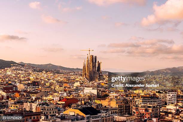 barcelona cityscape with sagrada familia at sunset, aerial view, catalonia, spain - sagrada familia barcelona stock pictures, royalty-free photos & images