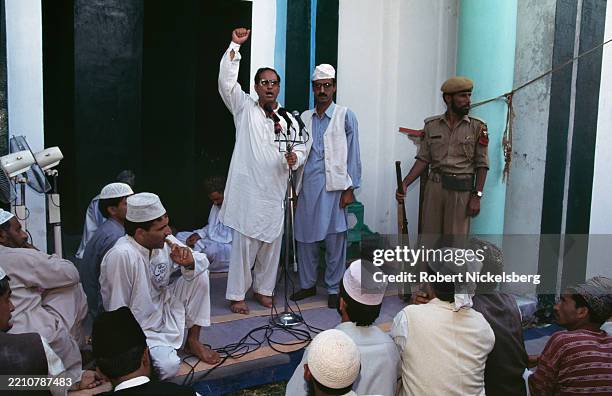 An unidentified religious leader delivers a sermon during a Friday prayer service at the Hazratbal Shrine, Srinagar, Jammu and Kashmir, India, 1995.