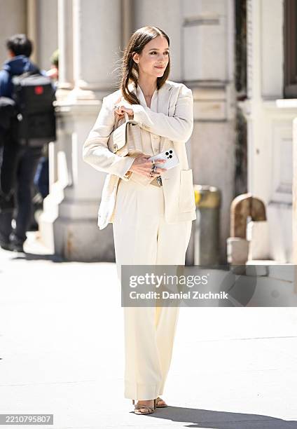 Charlotte Groeneveld is seen wearing an ivory Ralph Lauren jacket, cream shirt, ivory Ralph Lauren pants and Ralph Lauren bag outside the Ralph...