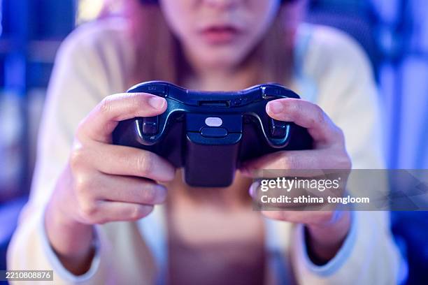 close-up of hands using a blank game controller. - playstation controller stock pictures, royalty-free photos & images