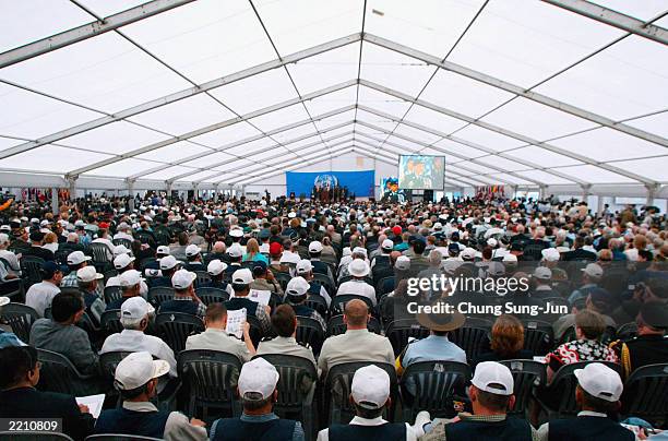 Veterans who participated in the Korean War attend a ceremony July 27, 2003 in the border village of Panmunjom in the demilitarized zone between...