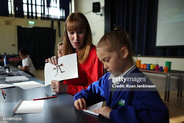 Angela Rayner, Deputy Prime Minister of the United Kingdom, talks with young pupils as she visits Palace Fields Primary School with Karen Shore,...