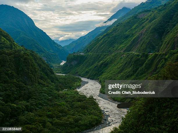scenic view of tropical river in banos, ecuador - amazone regenwoud stockfoto's en -beelden