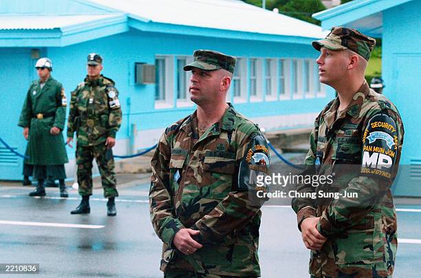 Two U.S. Military Policemen stand guard July 27, 2003 in the border village of Panmunjom in the demilitarized zone between South and North Korea....