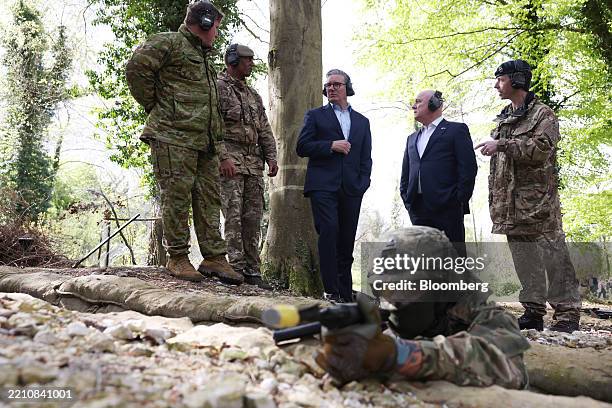Keir Starmer, UK prime minister, center, and Christopher Luxon, New Zealand's prime minister, second right, at an undisclosed military base, to watch...