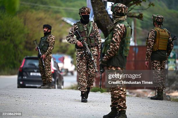 Paramilitary soldiers stands guard near Pahalgam on April 22, 2025 in Anantnag, India. Over 20 people, mainly tourists, were killed and many injured...