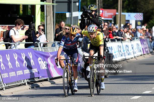 Race winner Remco Evenepoel of Belgium and Team Soudal Quick-Step and Wout Van Aert of Belgium and Team Visma-Lease a Bike on second place react...