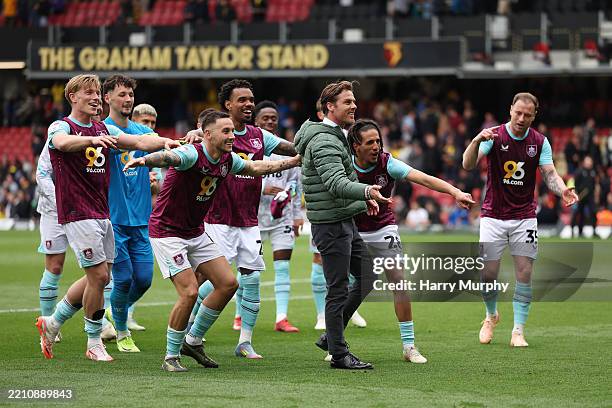 Players of Burnley celebrate victory to fans led by Scott Parker, Manager of Burnley, after their victory in the Sky Bet Championship match between...