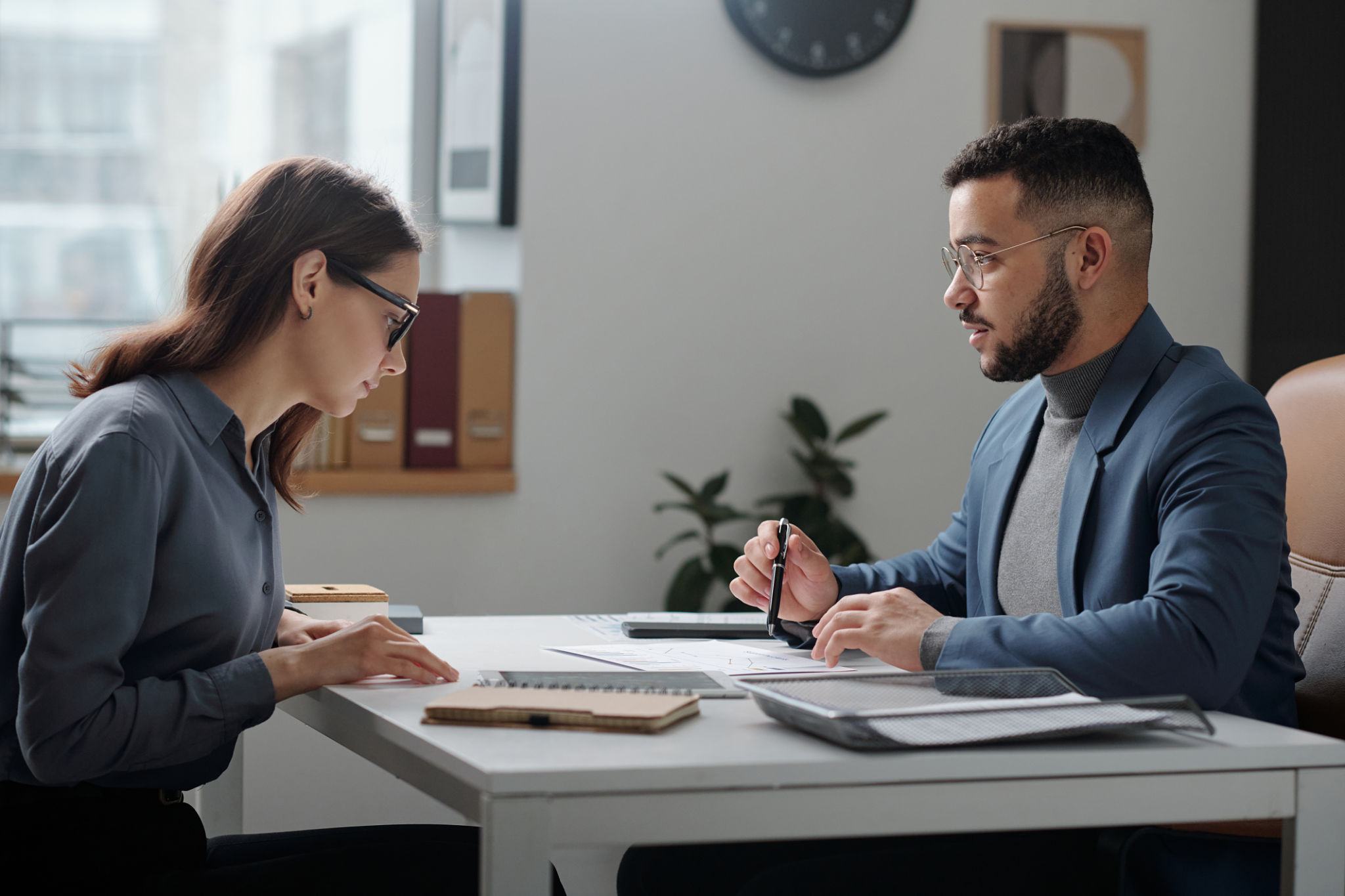 Manager in Meeting with Female Employee Manager in Meeting with Female Employee