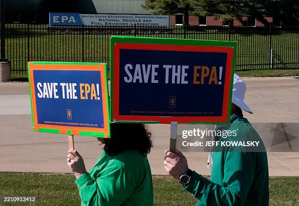 Demonstrators march during a "Hands off the EPA" rally outside the EPA offices in Ann Arbor, Michigan, on Earth Day, April 22, 2025.