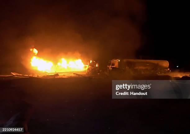 Al HUDAYDAH GOVERNORATE, YEMEN In this handout image provided by Houthi Media Center, fuel vans burn in the wake of U.S. Airstrikes targeting the Ras...