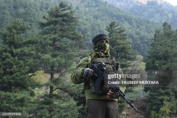 An Indian paramilitary serviceman keeps watch in Pahalgam, south of Srinagar on April 23 following an attack. At least 26 people were killed April 22...