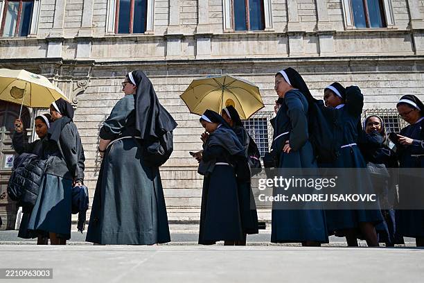 Catholic nuns walk in Rome near the Vatican, following the Pope's death, on April 23, 2025. Pope Francis's body arrived at Saint Peter's Basilica on...