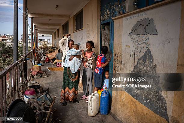 Displaced women in the Internally Displaced Person centre corridor, where they live in Mekele, the capital of Tigray. The end of USAID support and...