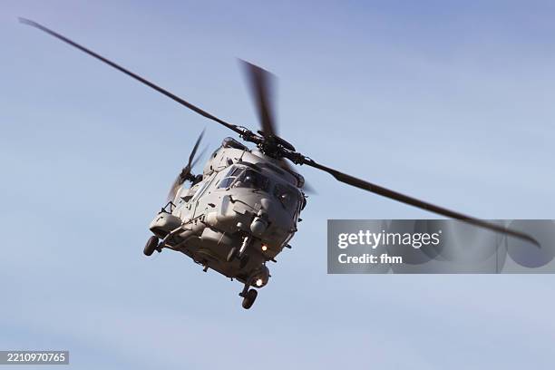 military helicopter in the sky - military helicopter stock pictures, royalty-free photos & images