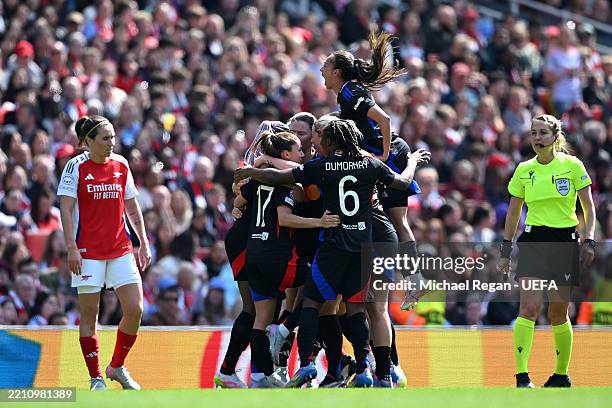 Kadidiatou Diani of Olympique Lyonnais celebrates scoring her team's first goal with teammates during the UEFA Women's Champions League semifinal...