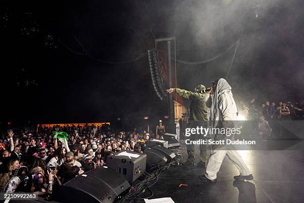 Members of the band Kneecap including Mo Chara and Moglai Bap perform onstage during Day 1 of Coachella Valley Music and Arts Festival on April 18,...