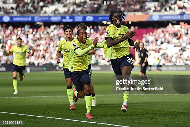 Lesley Ugochukwu of Southampton celebrates scoring his team's first goal with teammates during the Premier League match between West Ham United FC...