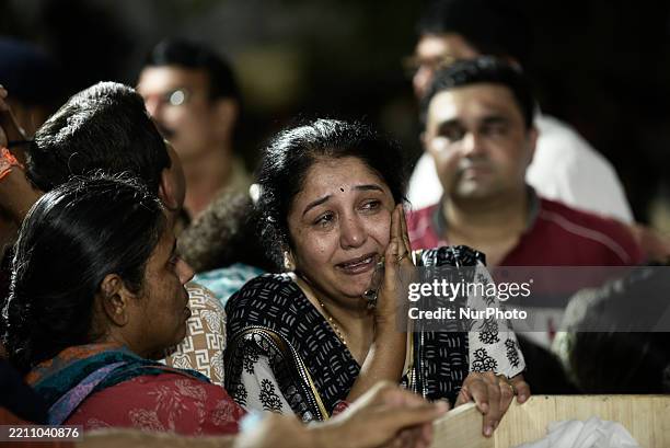 Family members mourn the loss of Sanjay Lele, who is killed in a suspected militant attack near Pahalgam, during his funeral in Dombivli, Thane...