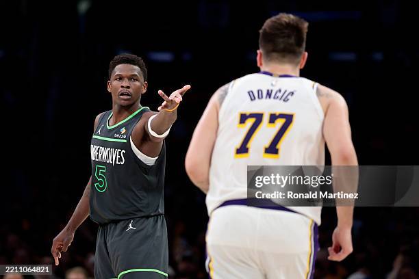 Anthony Edwards of the Minnesota Timberwolves reacts in front of Luka Doncic of the Los Angeles Lakers during the fourth quarter in Game One of the...