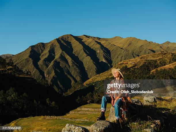 woman exploring in urubamba valley during trip to peru - hiking machu picchu stock pictures, royalty-free photos & images