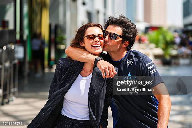 Carlos Sainz of Spain and Williams walks in the paddock giving a kiss to his girlfriend, Rebecca Donaldson, during the F1 Grand Prix of Saudi Arabia...