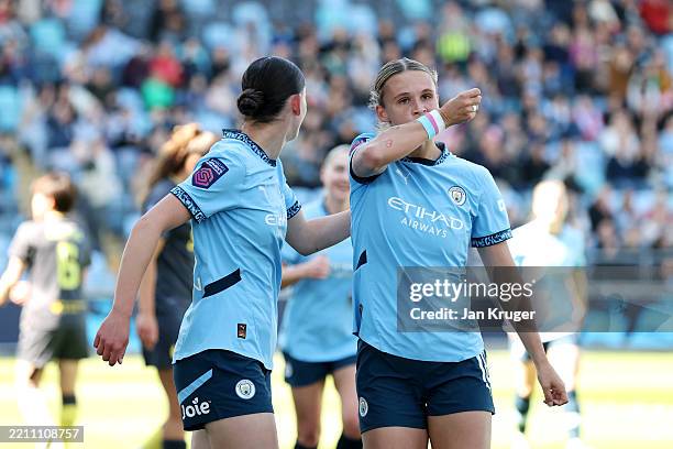 Kerstin Casparij of Manchester City kisses her wrist as she celebrates scoring her team's first goal during the Barclays Women's Super League match...
