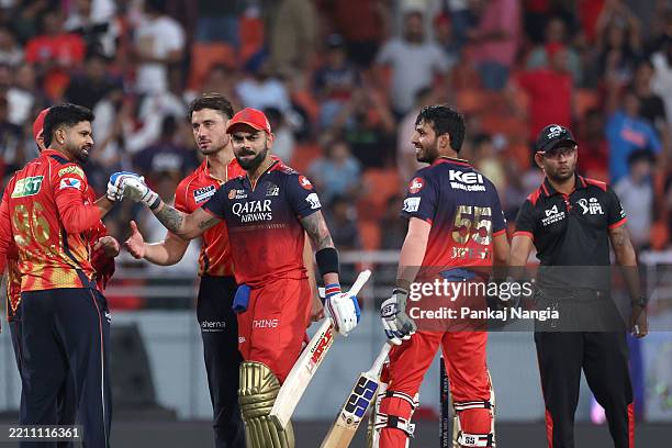 Virat Kohli of Royal Challengers Bengaluru and Jitesh Sharma of Royal Challengers Bengaluru celebrate their team's win over Punjab Kings during the...
