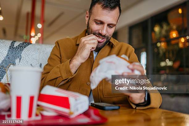 sometimes you have to have a cheat day - fast food restaurant stock pictures, royalty-free photos & images