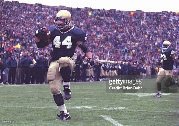 Fullback Marc Edwards of the Notre Dame Fighting Irish celebrates as he enters the end zone, scoring a touchdown, during the Fighting Irish's 38-10...
