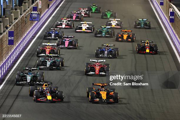 Oscar Piastri of Australia driving the McLaren MCL39 Mercedes leads Max Verstappen of the Netherlands driving the Oracle Red Bull Racing RB21 George...