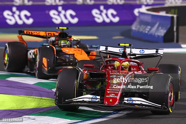 Lewis Hamilton of Great Britain driving the Scuderia Ferrari SF-25 leads Lando Norris of Great Britain driving the McLaren MCL39 Mercedes on track...