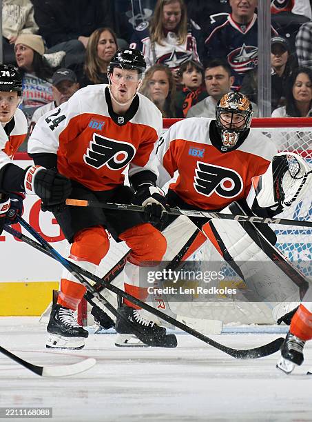 Nick Seeler and Samuel Ersson of the Philadelphia Flyers prepare to stop a shot on goal by the Columbus Blue Jackets at the Wells Fargo Center on...