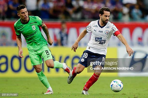 Atletico Nacional's midfielder Mateus Uribe AND Bahia's midfielder Everton Ribeiro fight for the ball during the Copa Libertadores group stage...