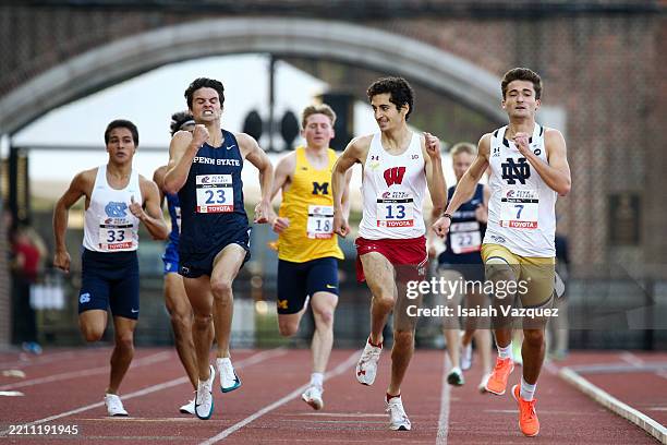 Matan Ivri of the Wisconsin Badgers looks over at Jake Allen of the Penn State Nittany Lions in the final stretch of the college men's 1500 meter run...