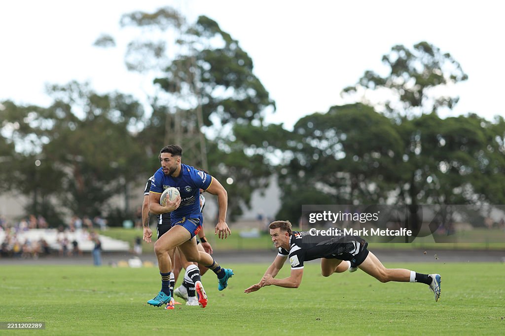 Araz Nanva of the Eels breaks a tackle to score a try during the