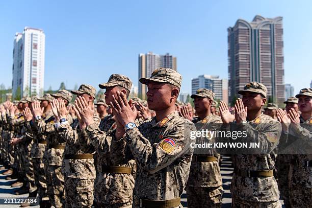 Korean People's Army soldiers participate in a commemorative march in the plaza of the April 25 House of Culture in Pyongyang on April 25 to mark the...