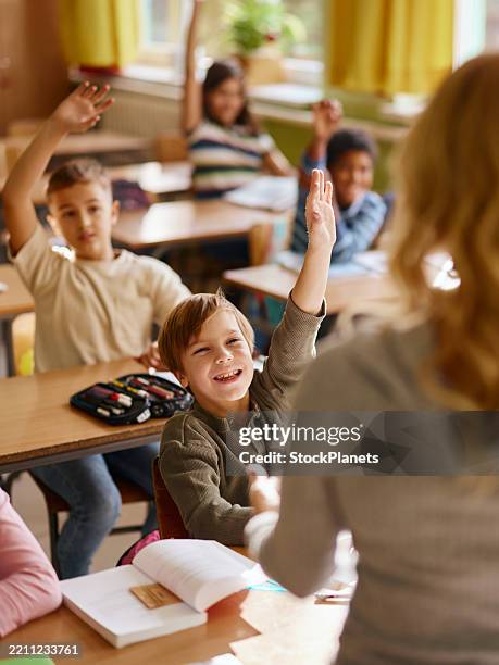 may i answer your question teacher? - boy asking stock pictures, royalty-free photos & images