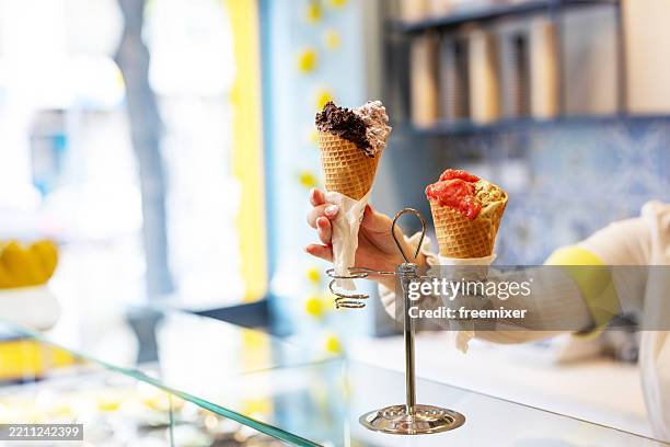 young woman working at an ice cream parlor - scoop shape stock pictures, royalty-free photos & images