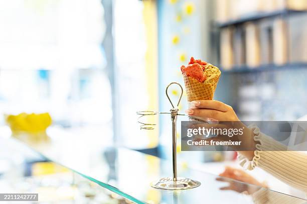 young woman working at an ice cream parlor - part time job stock pictures, royalty-free photos & images