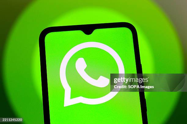 In this photo illustration, the WhatsApp logo is seen displayed on a smartphone screen.