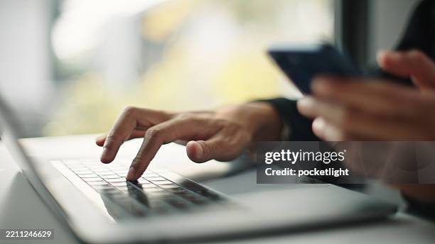 man multi-tasking at work. - multitasking computer stock pictures, royalty-free photos & images