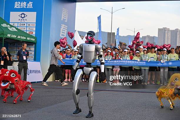 Humanoid robot gives a dance performance during Chongqing Shapingba Global Alumni Half Marathon on April 20, 2025 in Chongqing, China.